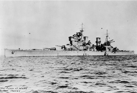 HMS Prince of Wales photographed in 1941, sometime prior to her May 24, 1941 engagement with the German battleship Bismarck. She is lowering a Supermarine Walrus amphibian aircraft over the side.