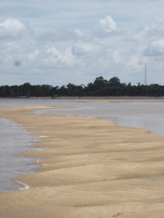 A photo of a sand bank in a river.