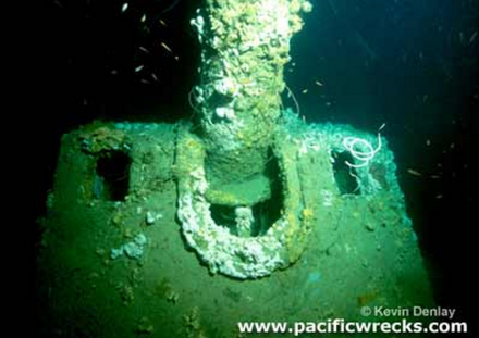 An underwater photo of a gun turret.
