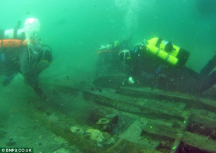 Divers inspecting the timber hull of the wreck (bnps.co.uk)