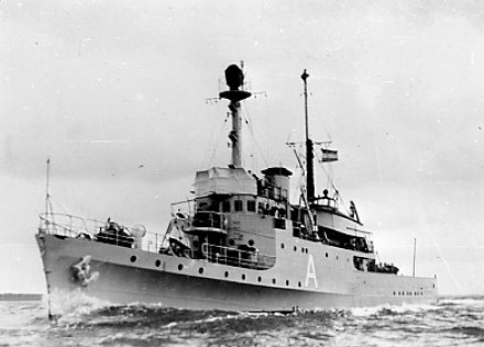 A black and white photo of the ship under way.