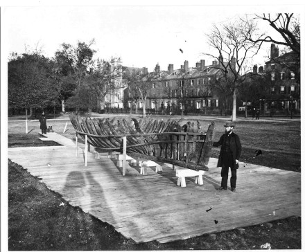This 1865 photo provided by the Pilgrim Hall Museum shows Leander Cosby, of Orleans, Mass., right, standing with remains of the 1626 shipwreck Sparrow-Hawk, on the Boston Common, in Boston. Cosby was an early visitor to the wreck site when it was uncovered in the 1860s, and helped excavate and preserve the vessel. (Josiah Johnson Hawes/Pilgrim Hall Museum via AP)