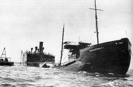 A black and white photo of the damaged ship.