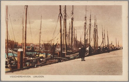 Old, colored postcard of the fishing port of IJmuiden.